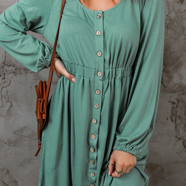  Rock the streets with this cute button up dress! Showcasing a scoop neckline