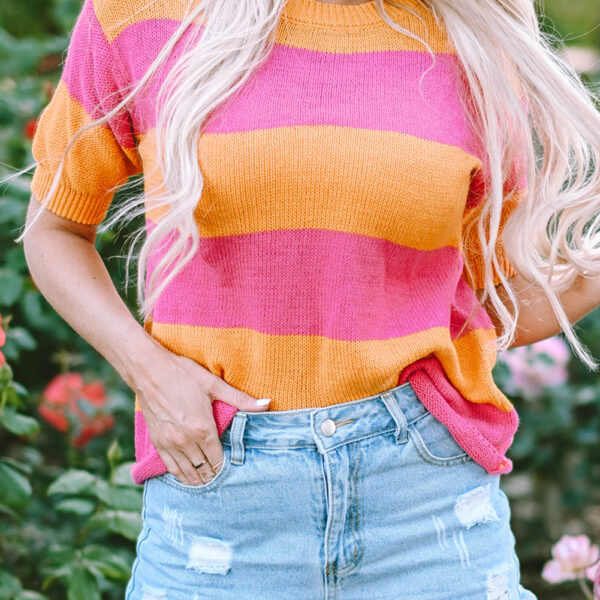 Add some pop to your wardrobe with this color block tee! Perfect for those warmer days with its round neck and half sleeves