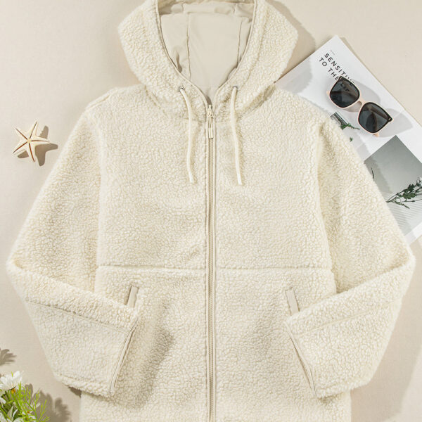 Stay cozy and fashionable in this zip-up fleece jacket. Customize your perfect fit with the adjustable hood and drawstring. Keep your essentials close in the handy side pockets. Whether you layer it up or sport it solo