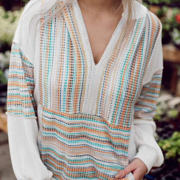 This hooded top allows for easy movement and a laid-back lookKeep your hands warm or store your essentials in the convenient kangaroo pocketEmbrace the vibrant and trendy multicolor stripe designEnjoy the relaxed and comfortable fit with the drop shoulder