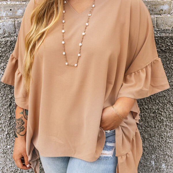 Get ready to rock your curves with this Marisol Plus Size Ruffled Batwing Sleeve V Neck Blouse! Whether you're keeping it casual with jeans or dressing it up with skirts
