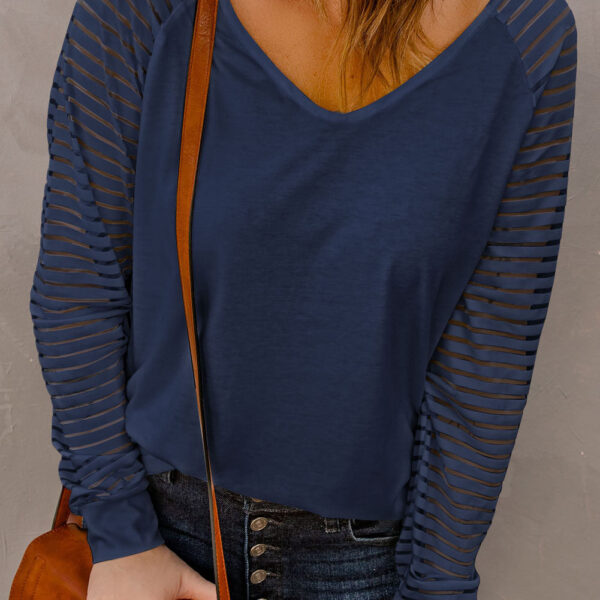 Unleash your arms in this playful top! With sheer panels on the sleeves