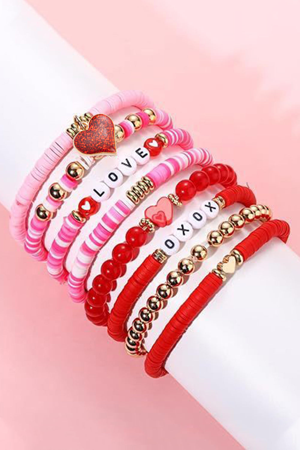 Show your love with this bracelet set featuring the chic LOVE XOXO design Embellished with a heart-shaped pendant