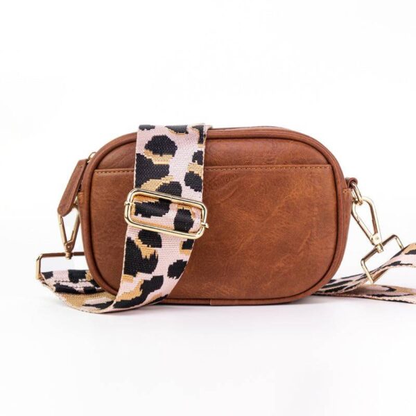 Now you can build your perfect compact bag! Pick your favorite color Crossbody bag and then pick your favorite style strap to build the perfect bag. All straps are interchangeable!Our beautiful Libby vegan leather Crossbody from the Threaded Pear is th