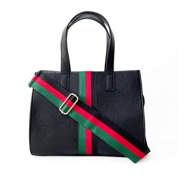 Our beautiful Becki tote from the Threaded Pear is the perfect take anywhere bag. The stunning vegan leather bag with accent stripe and matching shoulder strap features a zipper closure to access the spacious interior for all your must-have essentials.