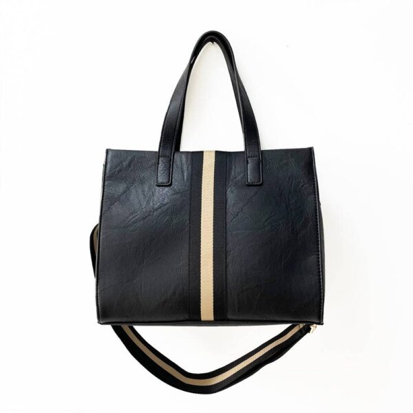 Our beautiful Becki tote from the Threaded Pear is the perfect take anywhere bag. The stunning vegan leather bag with accent stripe and matching shoulder strap features a zipper closure to access the spacious interior for all your must-have essentials.