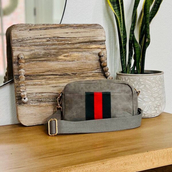 Our beautiful and soft Ava vegan leather Crossbody from the Threaded Pear is the perfect take anywhere bag. This stunning bag features a decorative front stripe and is a compact design with gold hardware top zipper for all your must-have essentials and