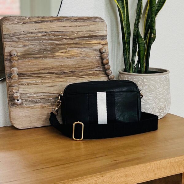 Our beautiful and soft Ava vegan leather Crossbody from the Threaded Pear is the perfect take anywhere bag. This stunning bag features a decorative front stripe and is a compact design with gold hardware top zipper for all your must-have essentials and