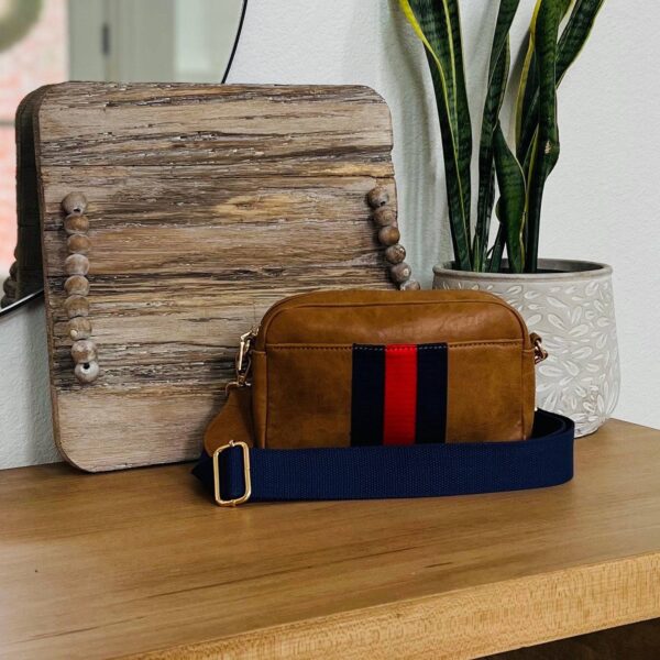 Our beautiful and soft Ava vegan leather Crossbody from the Threaded Pear is the perfect take anywhere bag. This stunning bag features a decorative front stripe and is a compact design with gold hardware top zipper for all your must-have essentials and