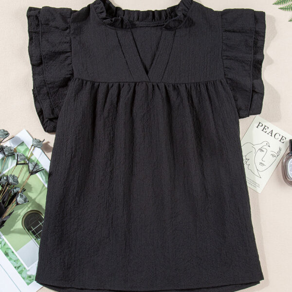 The Eileen Top is effortlessly chic with ruffle accents and flutter sleeves