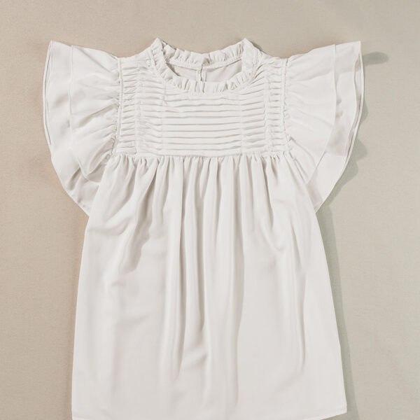 Get ready to feel fabulously feminine in this vibrant blouse! With its flirty frilled neck