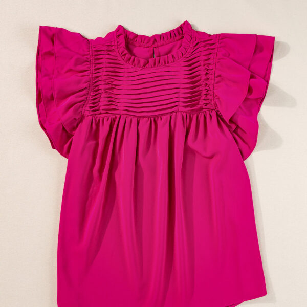 Get ready to feel fabulously feminine in this vibrant blouse! With its flirty frilled neck