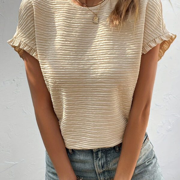 Add some flair to your wardrobe with this charming top! Its delicate texture adds a touch of elegance to any outfit. The short sleeves feature playful ruffles for a stylish and cozy fit. This solid-colored blouse is a perfect match for any bottoms you cho