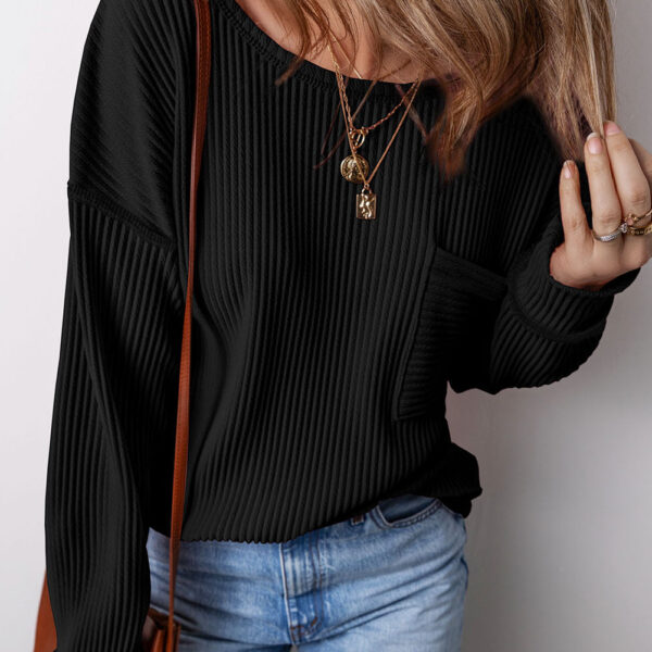 This top boasts a solid color and versatile style. With corded detailing