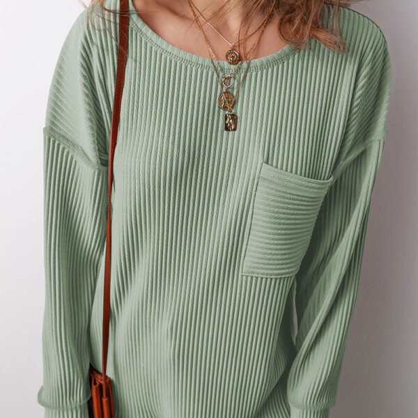 This top boasts a solid color and versatile style. With corded detailing