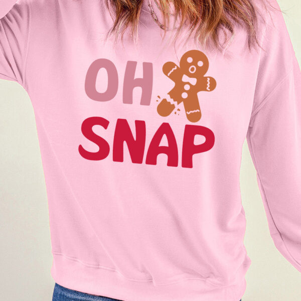  Looking for a way to spice up your everyday look? This trendy sweater has got you covered! Featuring an adorable gingerbread man design and a humorous saying