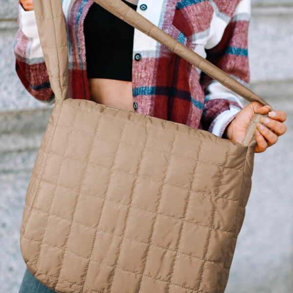 Add a touch of elegance to your look with the quilted design! This spacious tote (15x5x12 in) can easily hold all your essentials