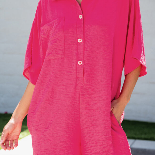 This women's romper comes in a solid color and features button closures