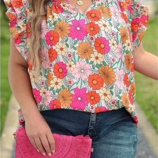 Flaunt your femme fatale allure in this gorgeous flowy top featuring a trendy notch neckline and whimsical frilly arms. The vivid flowery pattern will transport you to the blooming days of spring and summer. Pair it with jeans