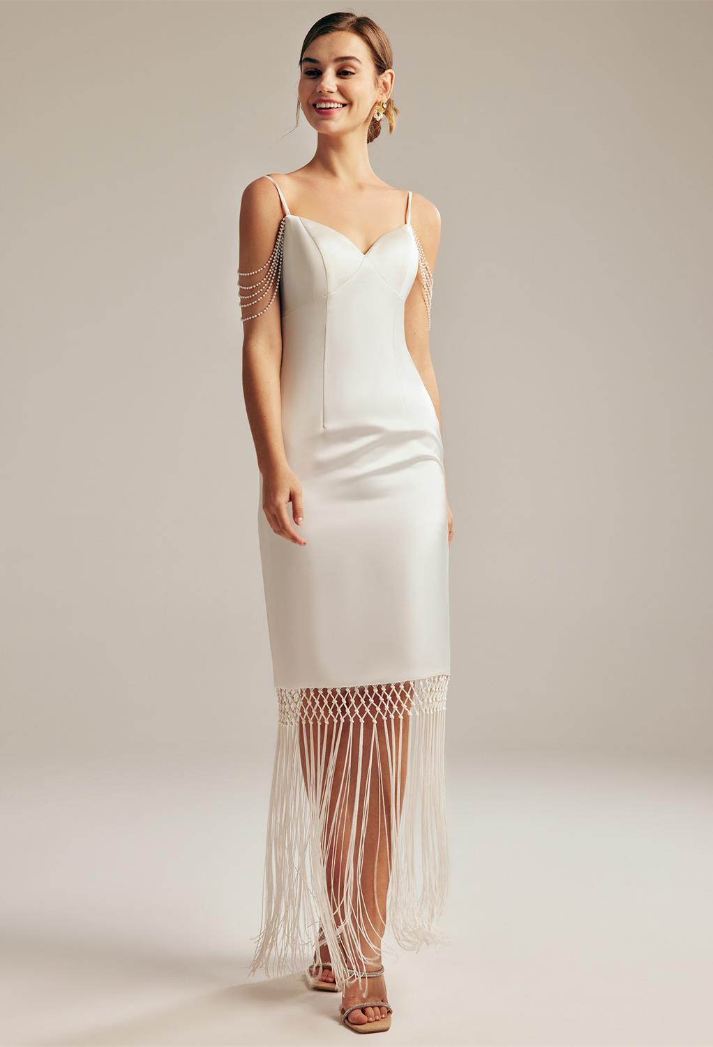 The AW Adeline wedding dress screams u201cElegance in Simplicity.u201d This floor-length bridal gown made with Tulle fabric is the go-to for the bride that shies away from the spotlight but appreciates a compliment. With sleeveless spaghetti straps that a