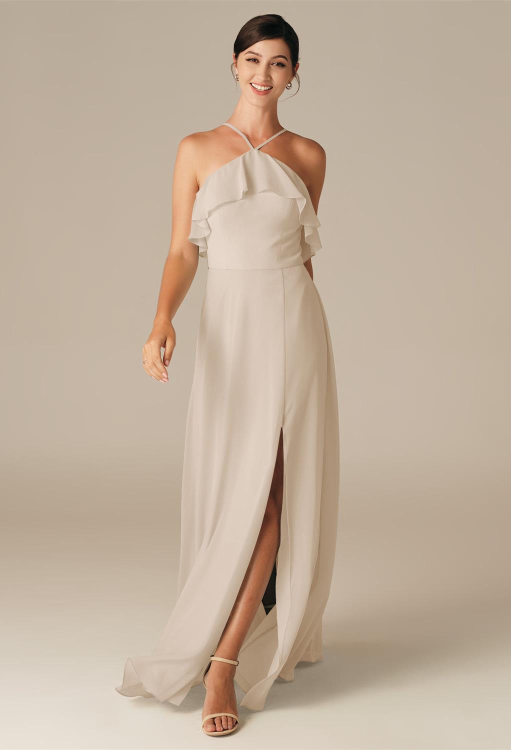 The daring thigh length slit in the Afra bridesmaid gown is quite flirty.The pleats and pretty layered look bodice add graceful movement that you'll fall in love with.Show off your toned legs with a pair of heels that will be perfect for dancing a