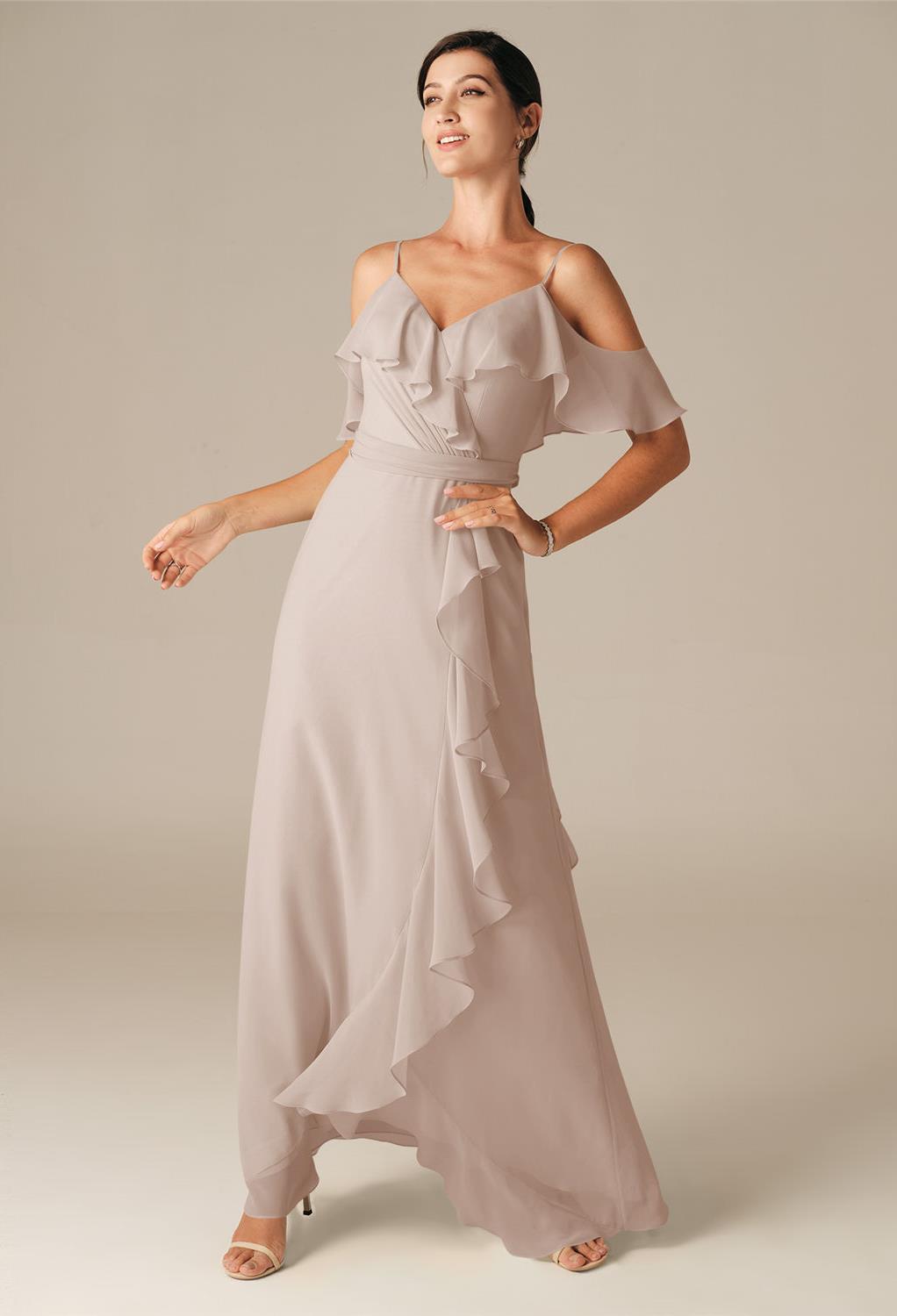 Spaghetti straps and pretty sleeves bring a lively flirty charm to the Barometer dress.The floor length of the dress and the understated pleated design offer a romantic delight to this chiffon gown.Perfect for the bridesmaid looking for a dress that will