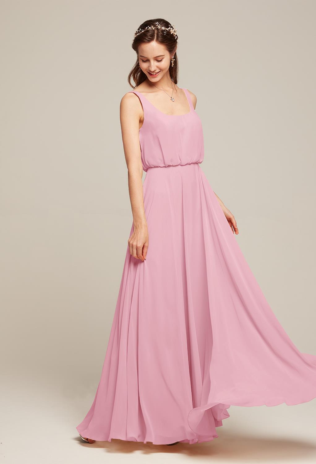 for a flattering fit. The skirt of the dress is pleated with easy flowing material that will move gracefully with every step that you take. Pick out the color
