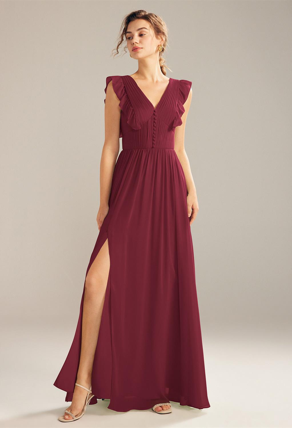 Chaba is a floor-length A-line dress with a v-neck line and built-in bra. Her ruffled design adorn the arms of the wearer. It features a thigh-high slit that highlight