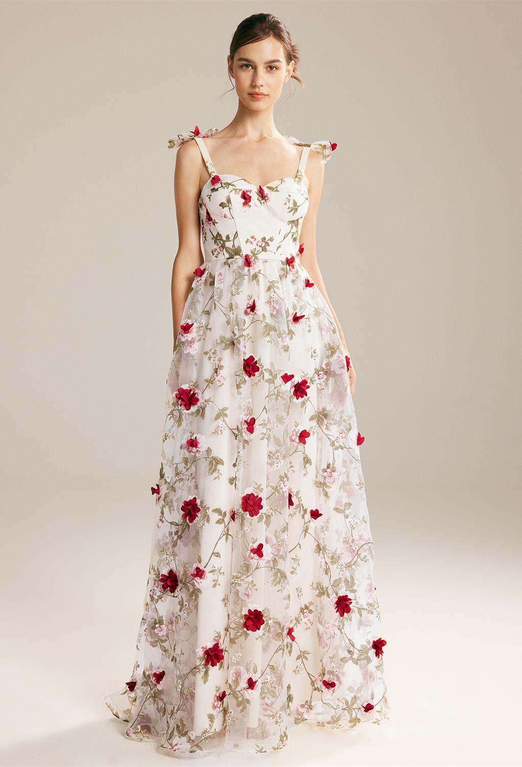 this A-line floor-length dress is designed as a garden of red roses. Its sheer straps uphold the fit