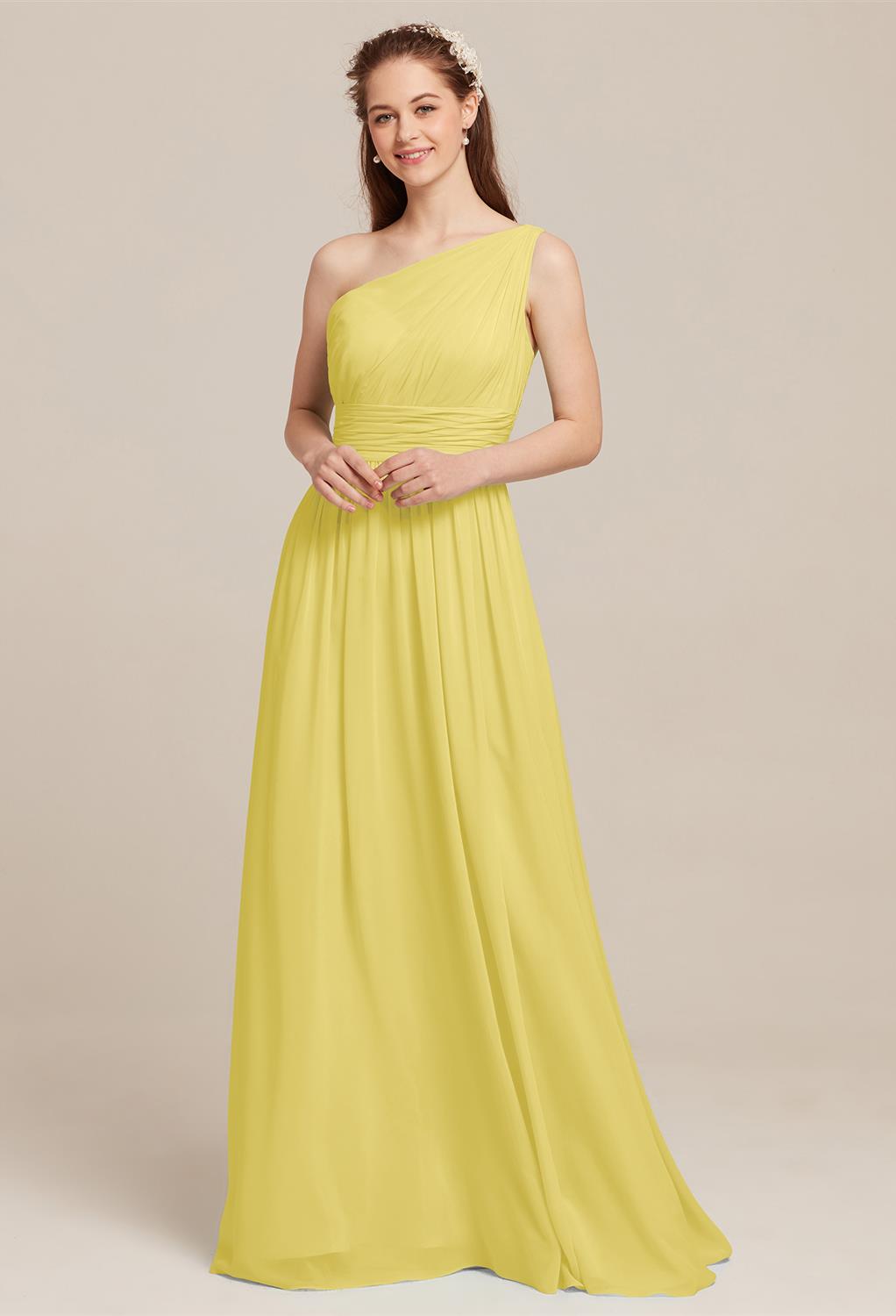 This updated toga brings classical style to your modern bridal party. Darlene is a stunning slip of chiffon that every woman can feel confident in. One-shoulder styling leads to a split strap in back for visual interest. Allover pleating and a wide cummer