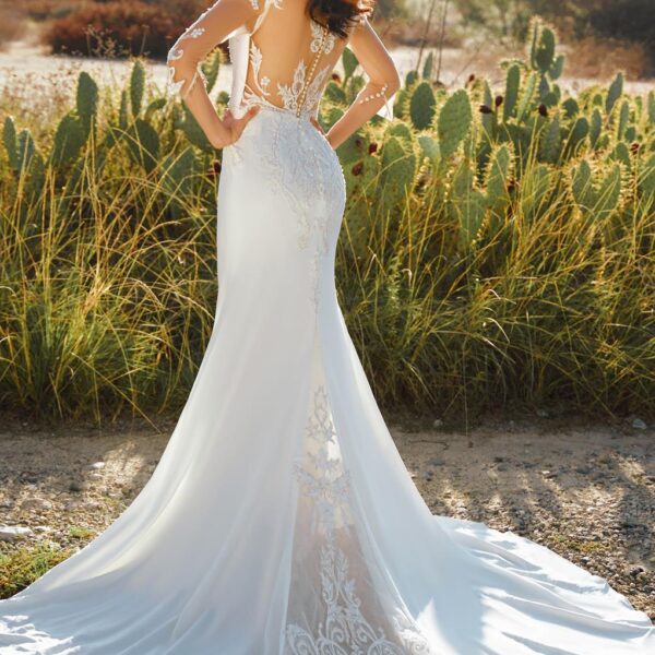 with its charming embroidery. The dress features a beautiful neckline
