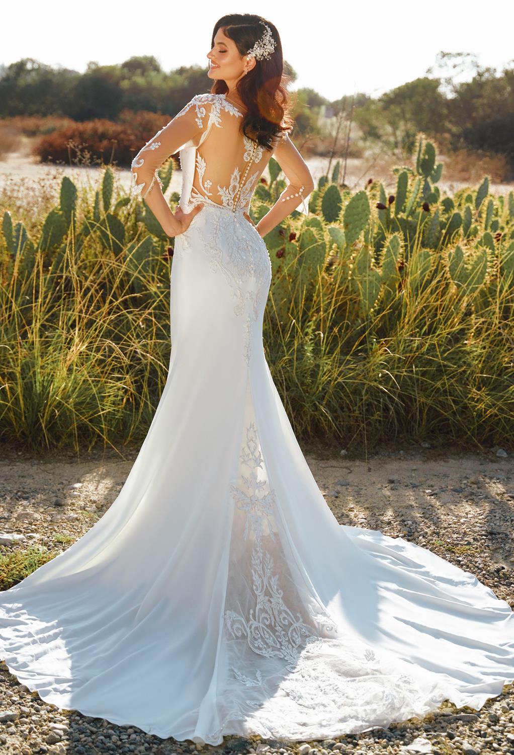 with its charming embroidery. The dress features a beautiful neckline