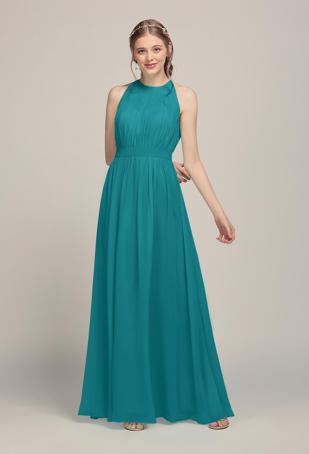 translucent halter bodice offers full coverage and just a peek at the sweetheart neckline beneath. A keyhole back shows