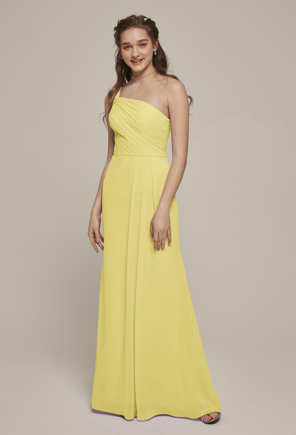 The off-the-shoulder elegance of the Elsbeth dress makes it a romantic choice for your next special event or occasion. The floor length skirt of the dress boasts delicate pleats that add to the movement of this graceful gown. Select your favorite color an