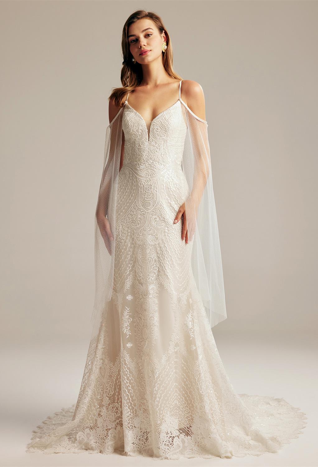 this floor-length gown makes the bride look and feel like a shooting star. With elements of a  sweetheart neckline