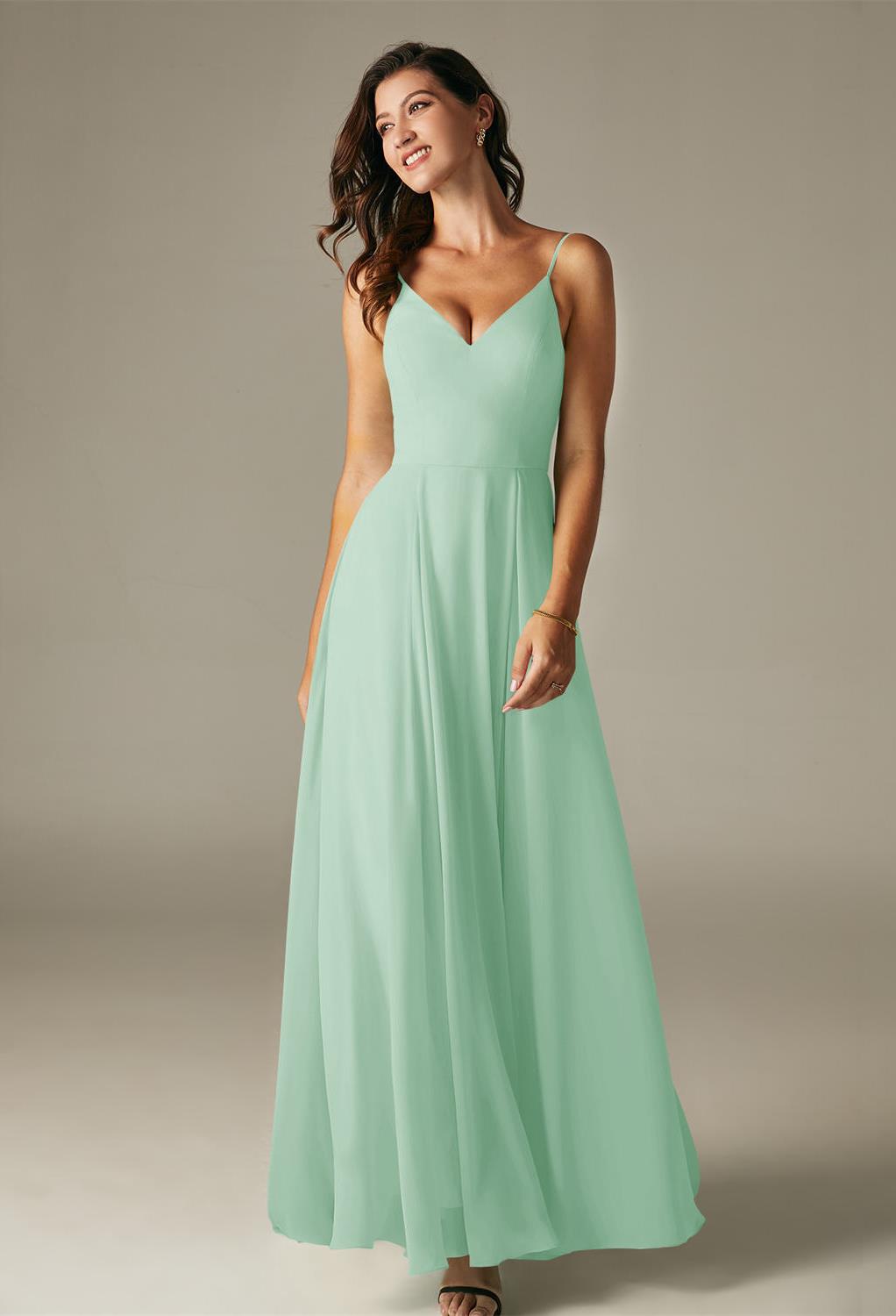 The Evie dress is a classic option for the bridesmaid looking to turn heads for all of the right reasons.The dress features a floor length skirt and a court train that will elegantly trail behind you with every step you take.The chiffon dress is offered i