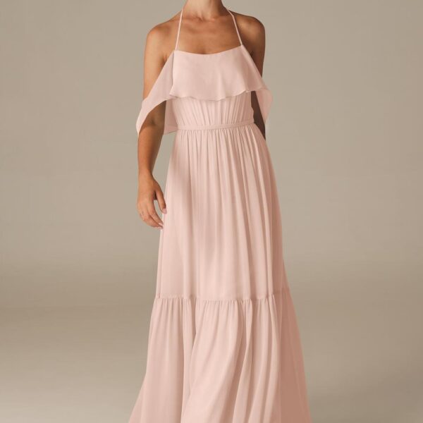 while the skirt flares with vibrant pleats adding volume