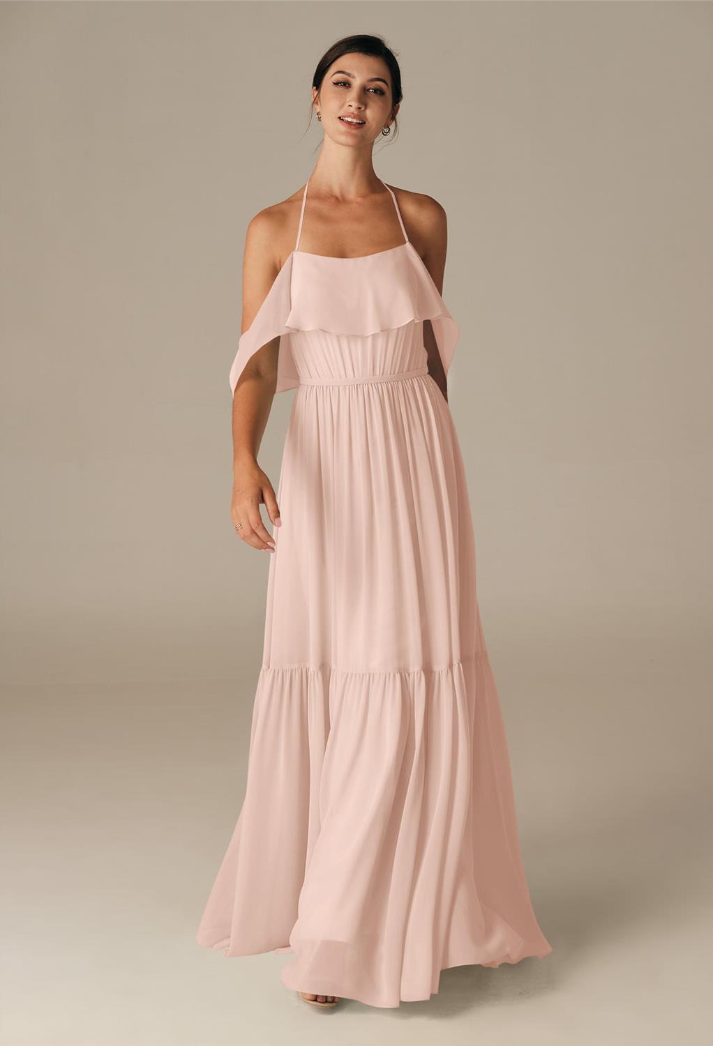 while the skirt flares with vibrant pleats adding volume