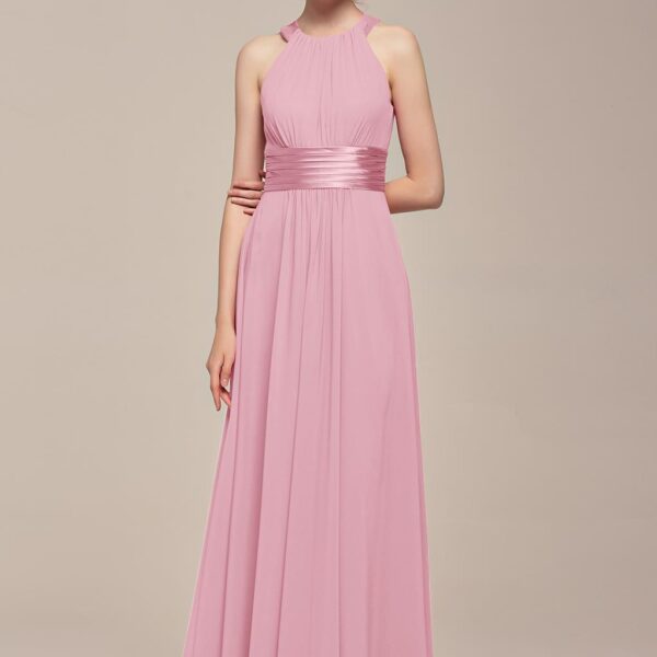 If you're looking for a gown that says "Party"! Then the Ione Jewel Neck Pleated Bridesmaid Dress is your girl. This pleated number offers modest coverage but is still up for some fun. The sliding halter neck shows off lovely sho