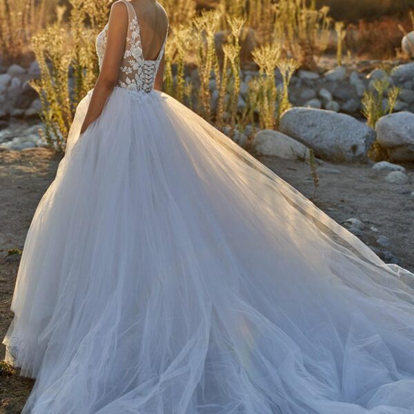 The Jacqueline wedding dress is offered in two color options. Select your gown in crisp white or perhaps in vintage-inspired ivory. The dress offers a curve-hugging design that will look perfect on the bride as she walks down the aisle.