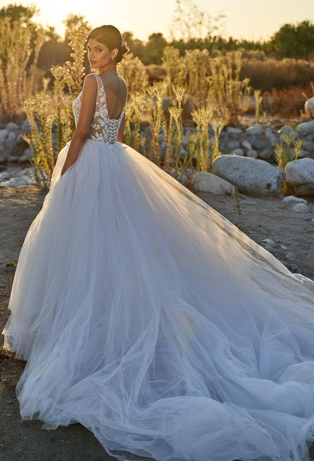 The Jacqueline wedding dress is offered in two color options. Select your gown in crisp white or perhaps in vintage-inspired ivory. The dress offers a curve-hugging design that will look perfect on the bride as she walks down the aisle.