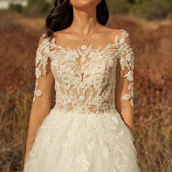 with an A-line style and 3/4 sleeves. The appliques covering the dress are charming