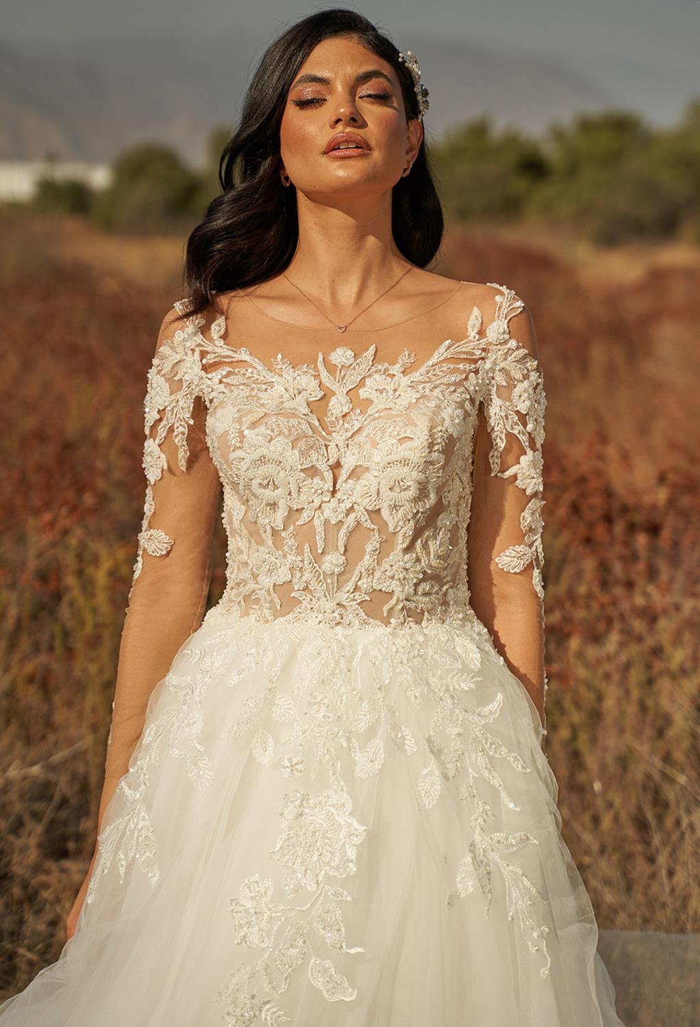 with an A-line style and 3/4 sleeves. The appliques covering the dress are charming