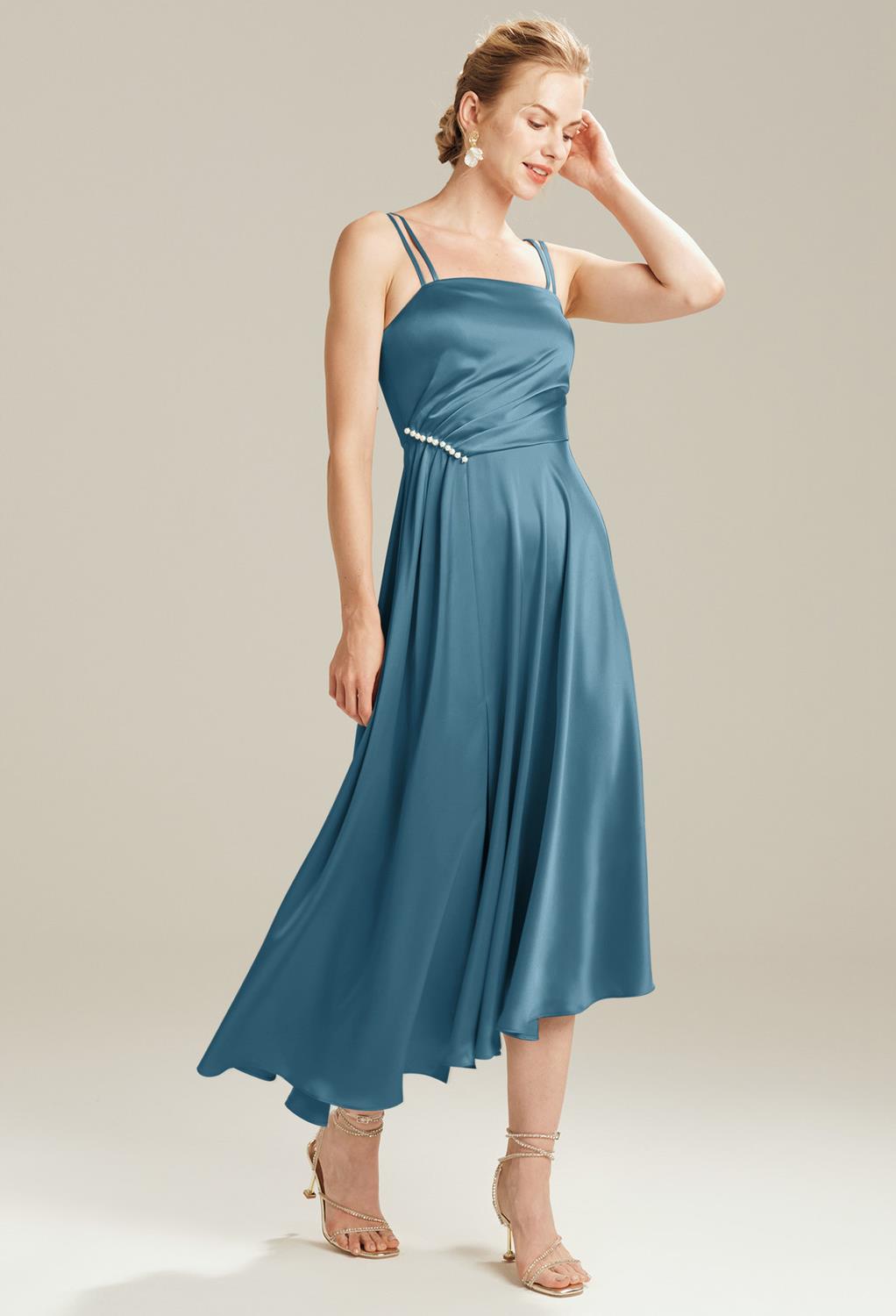 The Joann dress features a flattering bodice with the embellishments needed to add an extra hint of elegance to the romantic look curated for the bridesmaid. The double spaghetti straps are an interesting feature. Sleeveless gowns are always a perfect cho