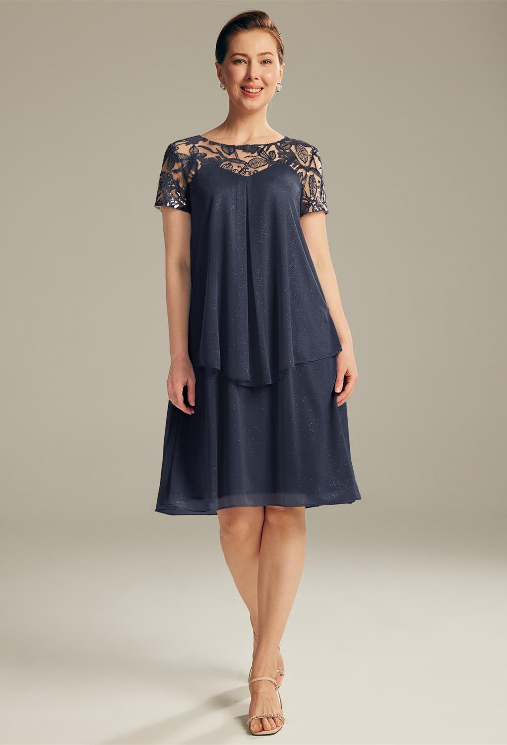 Rock every occasion nicely with the AW Kathryn dresses. The dress is made of glitter mesh and sequin designs. The knee-length dress is an A-line silhouette with overlapping. The bateau neckline and cap sleeves and completely lined with a built-in bra to g