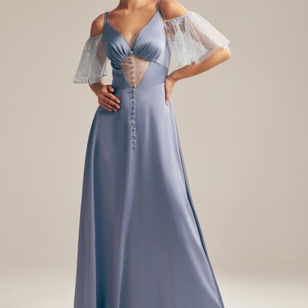 artfully tailored to skim the floor with its elegant A-line grace