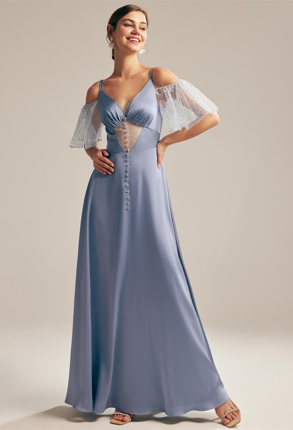 artfully tailored to skim the floor with its elegant A-line grace