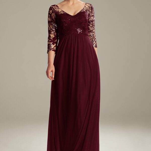 As a mom you can rock the wedding party with the AW Messi dress. The dress is made of glitter mesh with sequin adornment. The sleeves measure 3/4 in length. The V-neckline gives the dress a more fashionable look. The floor-length dress has a lined built-i