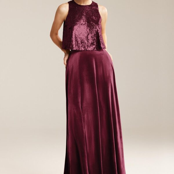 A-line dress is made of premium velvet and has a jewel-neckline. The two-piece dress includes a comfy sequence top that glows smoothly to enchant on