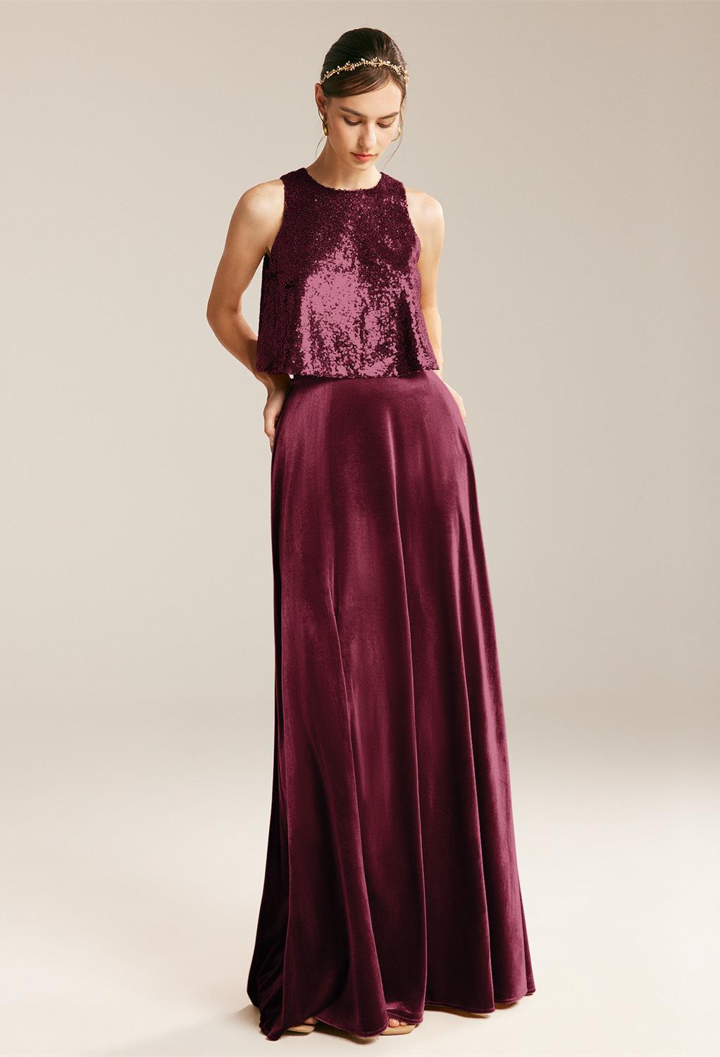 A-line dress is made of premium velvet and has a jewel-neckline. The two-piece dress includes a comfy sequence top that glows smoothly to enchant on